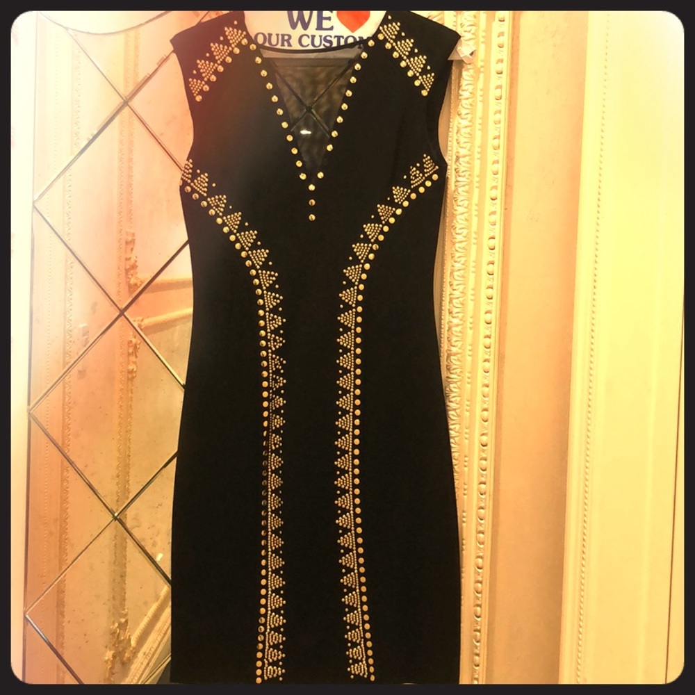 Black with gold studded dress.
